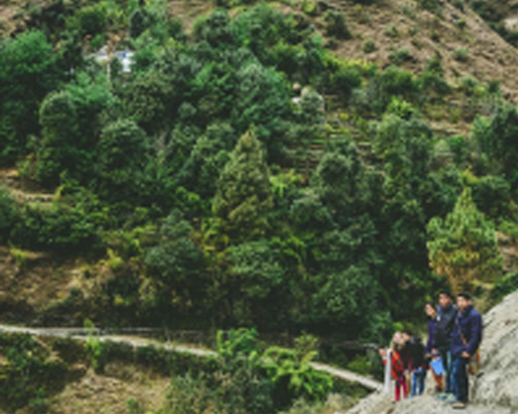 The team hiking up to a village.