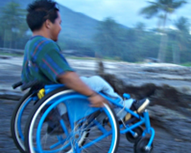 Bryan Cubao, a welder in the southern Philippine island of Mindanao, hits the beach in a chair built locally to his measurements.