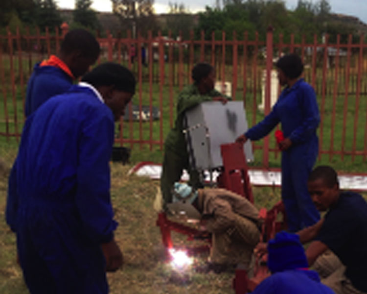 Lesotho team installing a prototype Parabolic Trough Collector (PTC) at the National University of Lesotho in November 2014