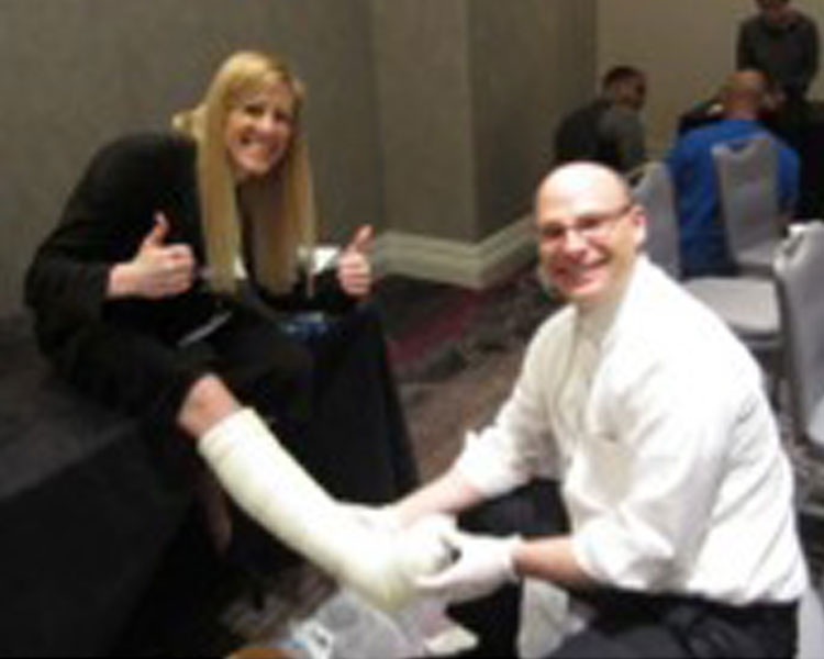 Danielle Zurovcik (left) and Jon Bloom, MD (right) learning about off-loading technologies at DFCon 2014.