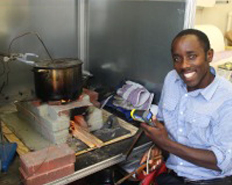 D-Lab Visiting practitioner Elius Muhimbise from Uganda evaluates his low-cost mud/brick wood stove
