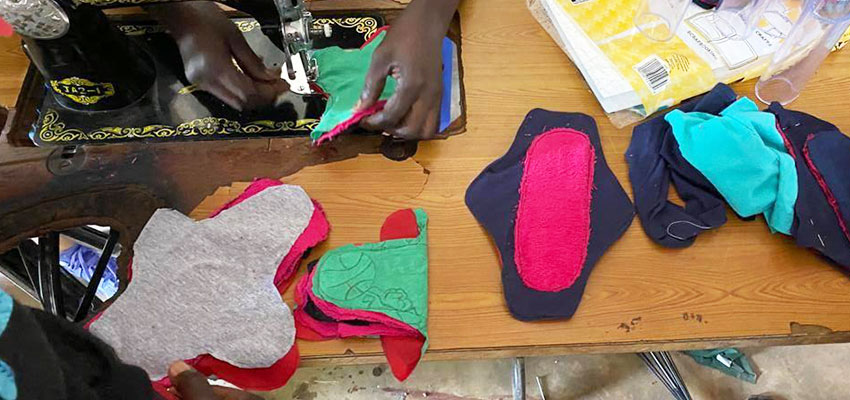 Workshop participants making a menstrual pad. Kenya, IAP 2020