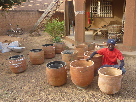 Man with many clay pots.