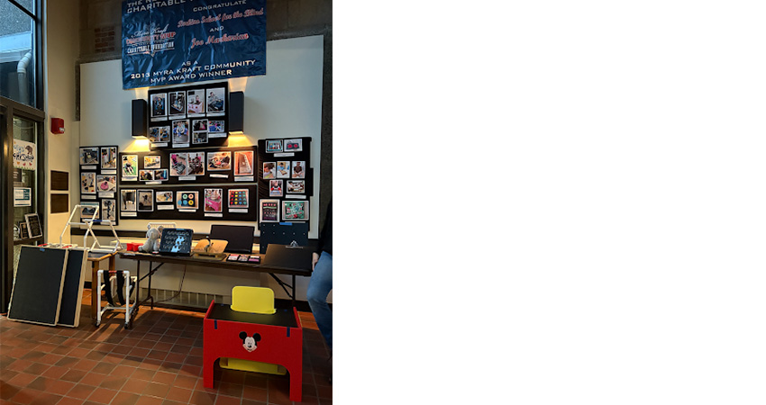 Workshop with red stool in foreground.