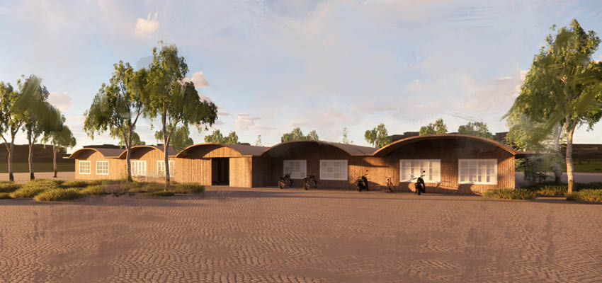 A wide one story building in a dry landscape.