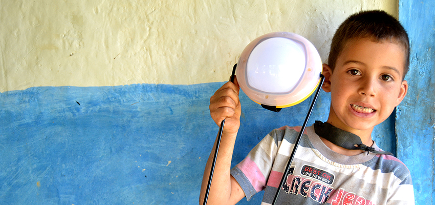 Boy with solar light, Morocco.