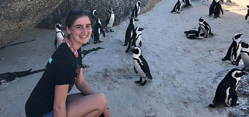 Abigail Anderson with penguins, Boulder Beach.
